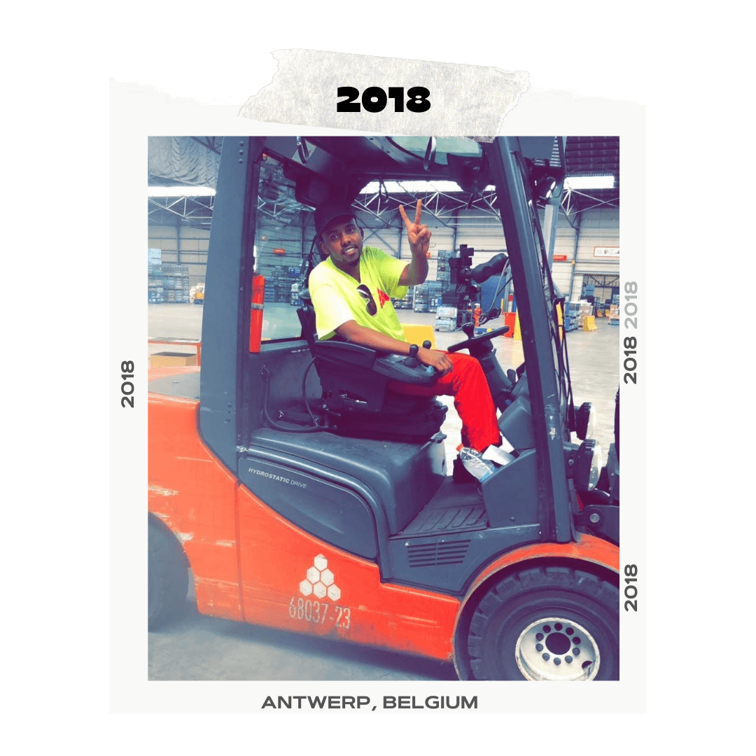 Warsame working with a forklift in 2018